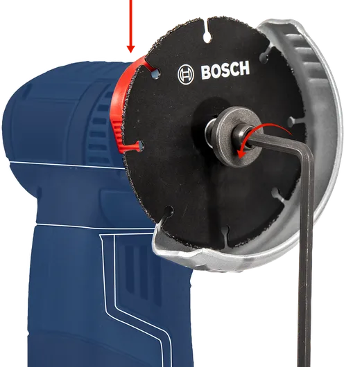 Hex key tightening a circular saw blade onto a blue power tool.