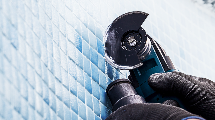 Object #200360603: 2793207_web_003 Person wearing safety equipment cuts ceramic wall tiles with a rotary power tool.
