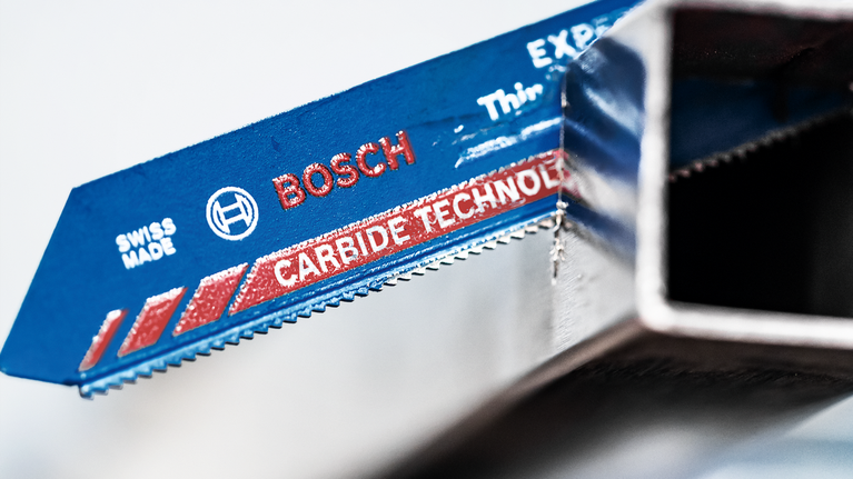 EXPERT ‘Thin Tough Metal’ S 922 EHM Reciprocating Saw Blade 1-pc Saw blade with carbide technology cutting through a metal square tube.
