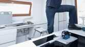 Laser leveling tool with blue and black casing for precise alignment tasks.