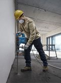 Bosch GBH 6-42 C rotary hammer drilling into concrete.
