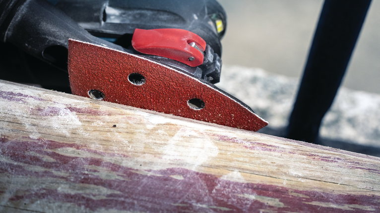 PRO F460 Sanding Sheet, 93 x 93 mm, G60, G80, G120, G180, G240, 10 pcs Detail sander smoothing a wooden surface.