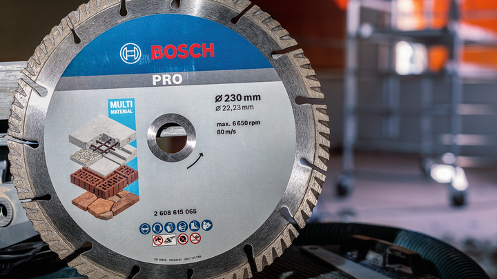 Object #200456639: 3087975_app_web_02 Diamond saw blade for cutting multiple materials is positioned in a workshop.