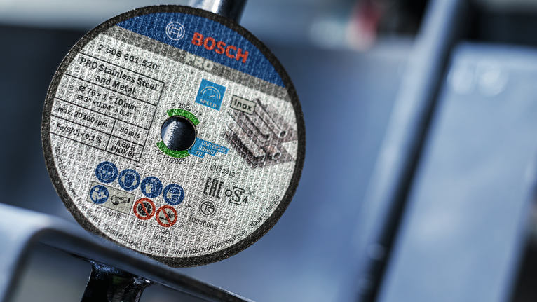 PRO Stainless Steel and Metal Bonded Cutting Disc, 76 x 1 x 10 mm Close-up of a mounted metal cutting disc with safety and usage information.