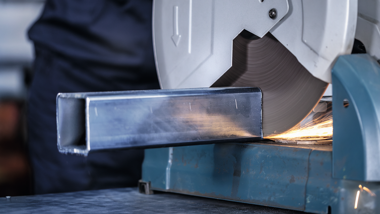 PRO Metal Cutting Disc, 355 x 3 x 25.4 mm Metal cutting saw slicing through a steel square tube with visible sparks.