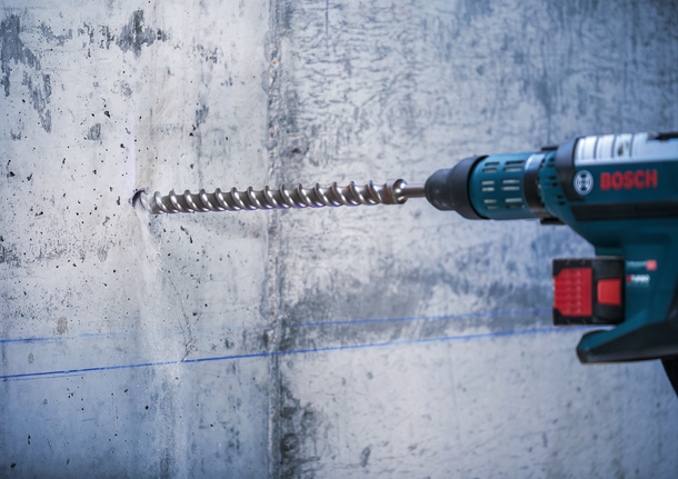 PRO SDS-max-7 Drill Bit, 35x400x520 mm Rotary hammer drilling into a concrete wall.