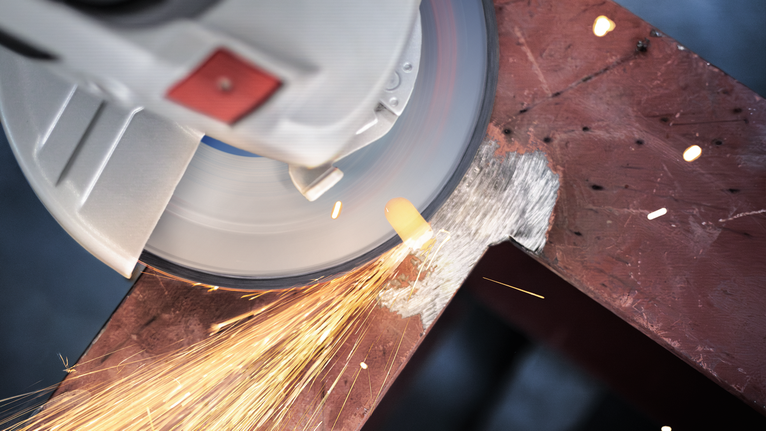 PRO Metal Grinding Disc, A 24 S BF, 180 x 6.6 x 22.23 mm, Depressed Centre Angle grinder cutting through metal with bright sparks flying.