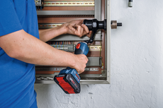 Bosch hole cutter accessory used for electrical cabinet installation.