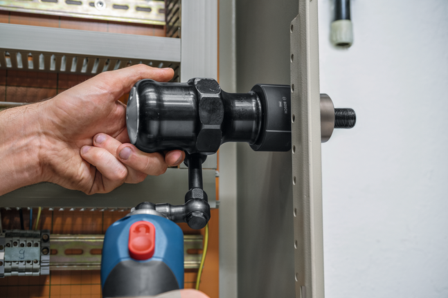 Bosch sheet metal hole cutter used with power drill.