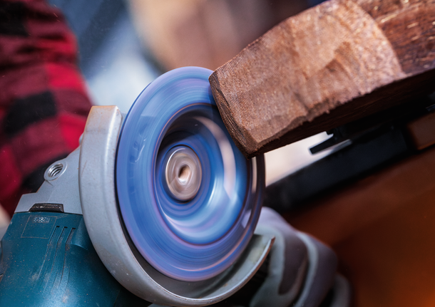 Bosch angle grinder disc sanding wood.