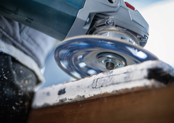 Bosch diamond cutting disc cutting through stone.