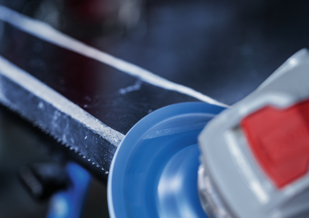 Bosch abrasive disc smoothing metal surface.
