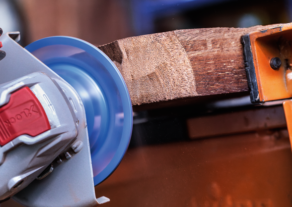Bosch X-Lock abrasive disc sanding rough wood.