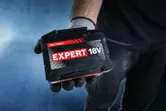 Bosch Expert 18V 15Ah battery pack in a gloved hand.