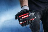 Bosch Expert 18V battery pack in gloved hand.