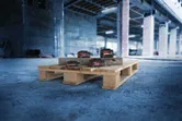 Bosch 18V Expert battery packs on a wooden pallet.