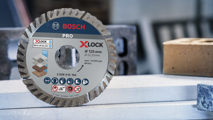 Diamond saw blade displayed upright on a construction site workbench.