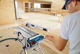 Man using table saw.
